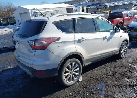 2017 Ford Escape Titanium z USA, uszkodzony, nr VIN 1FMCU9J9XHUB30774